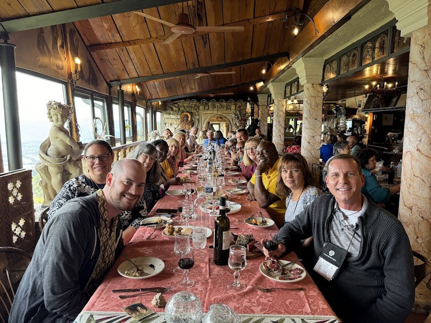 Our pilgrim group celebrating Christmas dinner in September at a restaurant in Greccio.